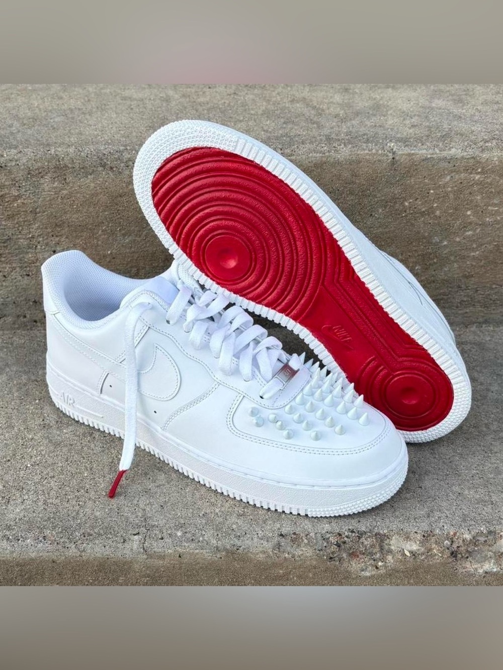 Custom made Nike Air Force 1
Low with Red Bottoms and White Metal Spikes